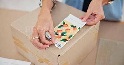Online order, label sticker and woman hand with small business in fashion with delivery and cardboard box. Stock, startup and sales of ecommerce and boutique at home of a entrepreneur with package