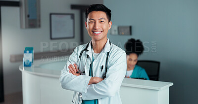 Happy, doctor arms crossed and Asian man, nurse or surgeon with career smile, job experience or pride. Hospital portrait, medical cardiology and professional healthcare worker for clinic support