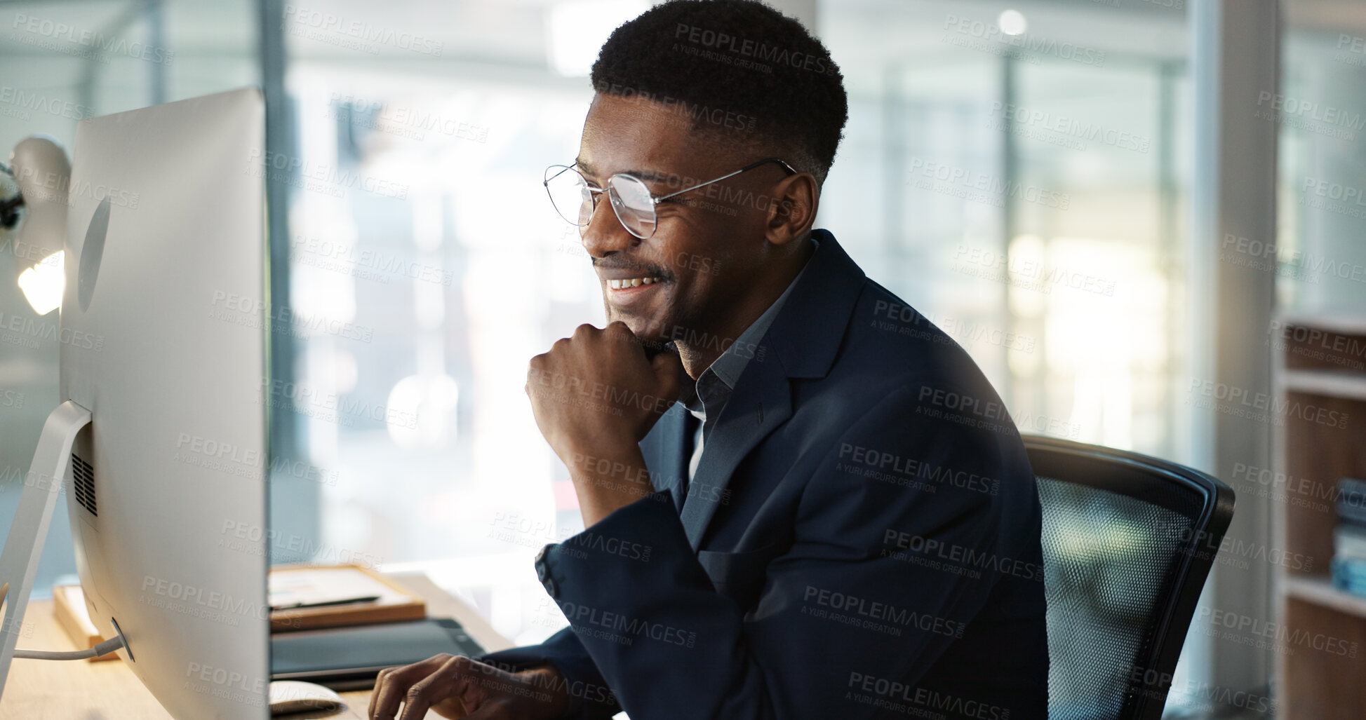 Buy stock photo Thinking, businessman and reading on computer with a smile in office for email, feedback or communication. Working, online or black man with research, inspiration or ideas from Nigeria report or news