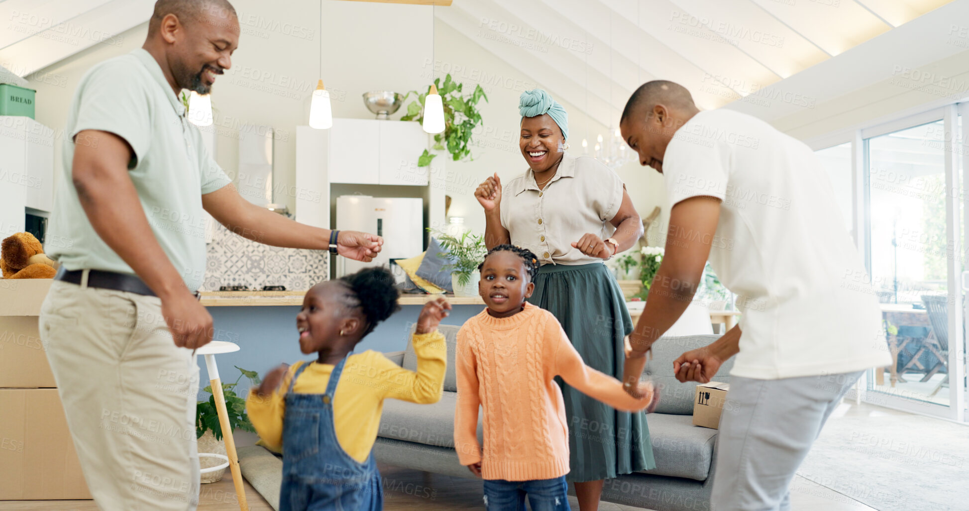 Buy stock photo Moving, boxes and parents with kids dancing in living room of new house, happiness and investing in home. African mother, father and children with cardboard box, real estate and happy black family.