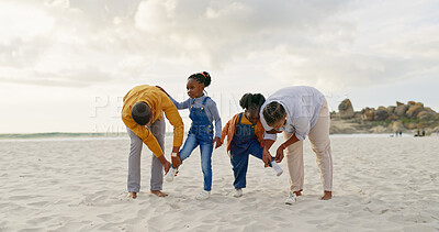 Summer, sand and a black family at the beach with shoes for walking or running together. Happy, travel and African children with parents getting ready for playing by the sea during a holiday