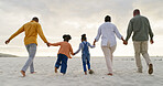 Happy, love and holding hands with black family at beach for summer, vacation and relax. Holiday, support and travel with parents and children walking on coastline for care, trust and freedom