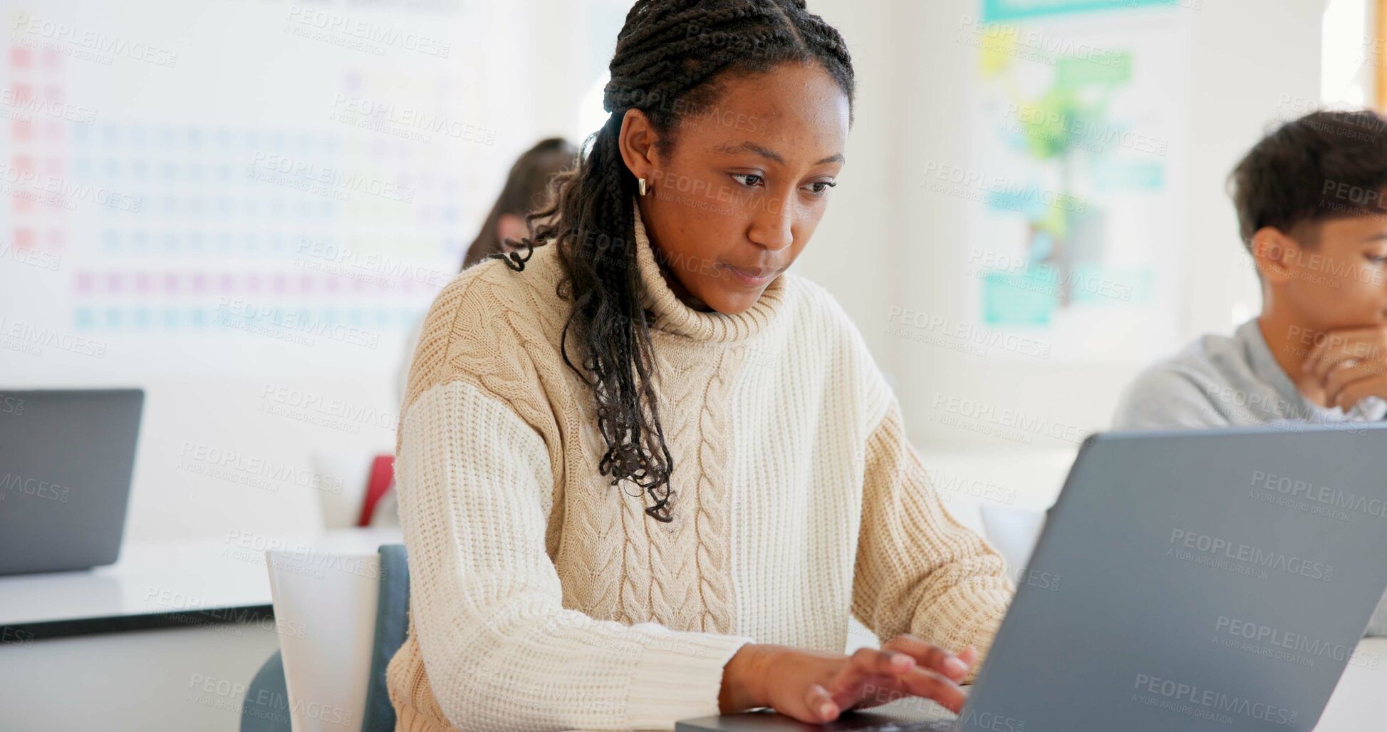 Buy stock photo Girl, students and laptop in a classroom, knowledge and creativity with connection, typing and learning. African person, academic and pc with kids, studying and education with lessons and high school