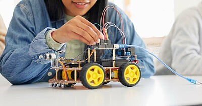 Technology, closeup and car robotics of students in classroom, education or learning electronics with cables and wire for innovation. School kids, learners and knowledge in science class for research