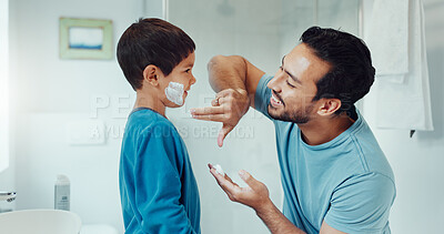 Shaving, bathroom and father teaching child about grooming, hygiene and facial routine. Happy, help and a young dad showing a boy kid cream or soap for hair removal together in a house in the morning