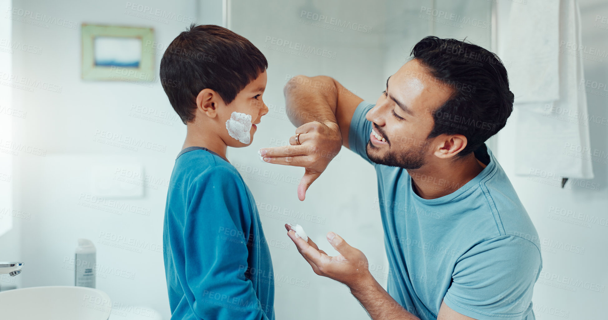 Buy stock photo Shaving, bathroom and father teaching child about grooming, hygiene and facial routine. Happy, help and a young dad showing a boy kid cream or soap for hair removal together in a house in the morning