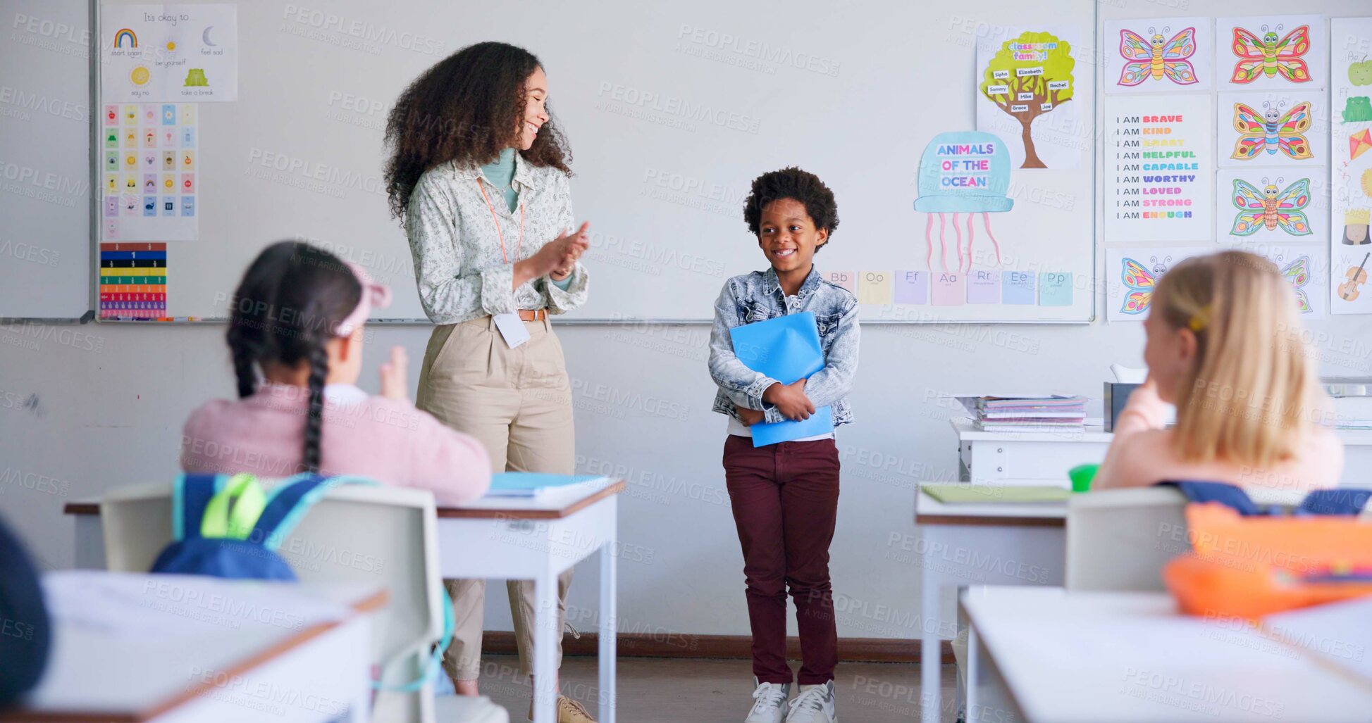 Buy stock photo Class paper, presentation and child speaker with applause and cheering in classroom at school. Young kid, education and oral reading of project with student and teacher with children group discussion