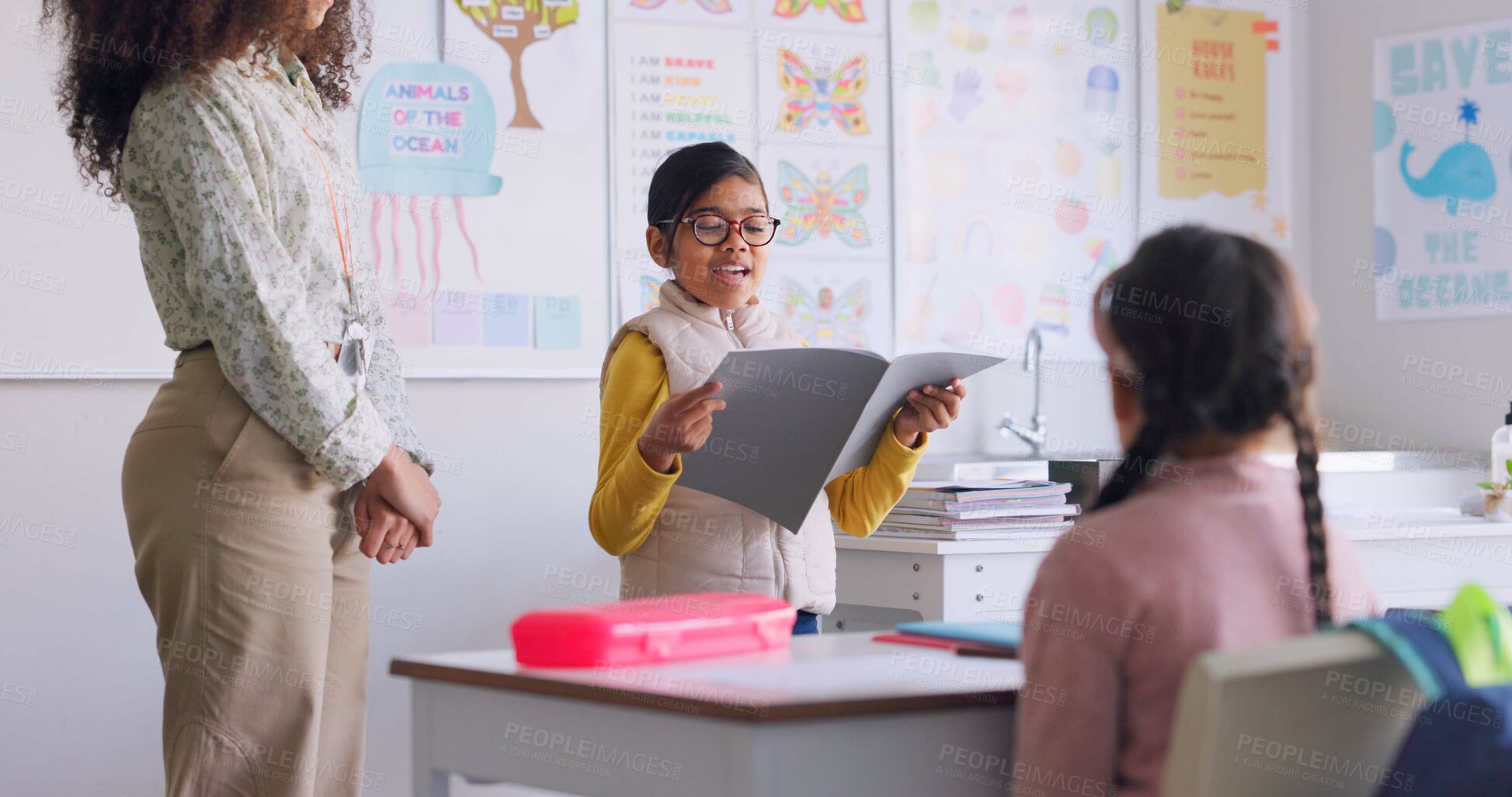 Buy stock photo School book, child and reading in class for learning, development and communication. A smart girl kid or student and woman teacher for language story, support and confidence in elementary classroom