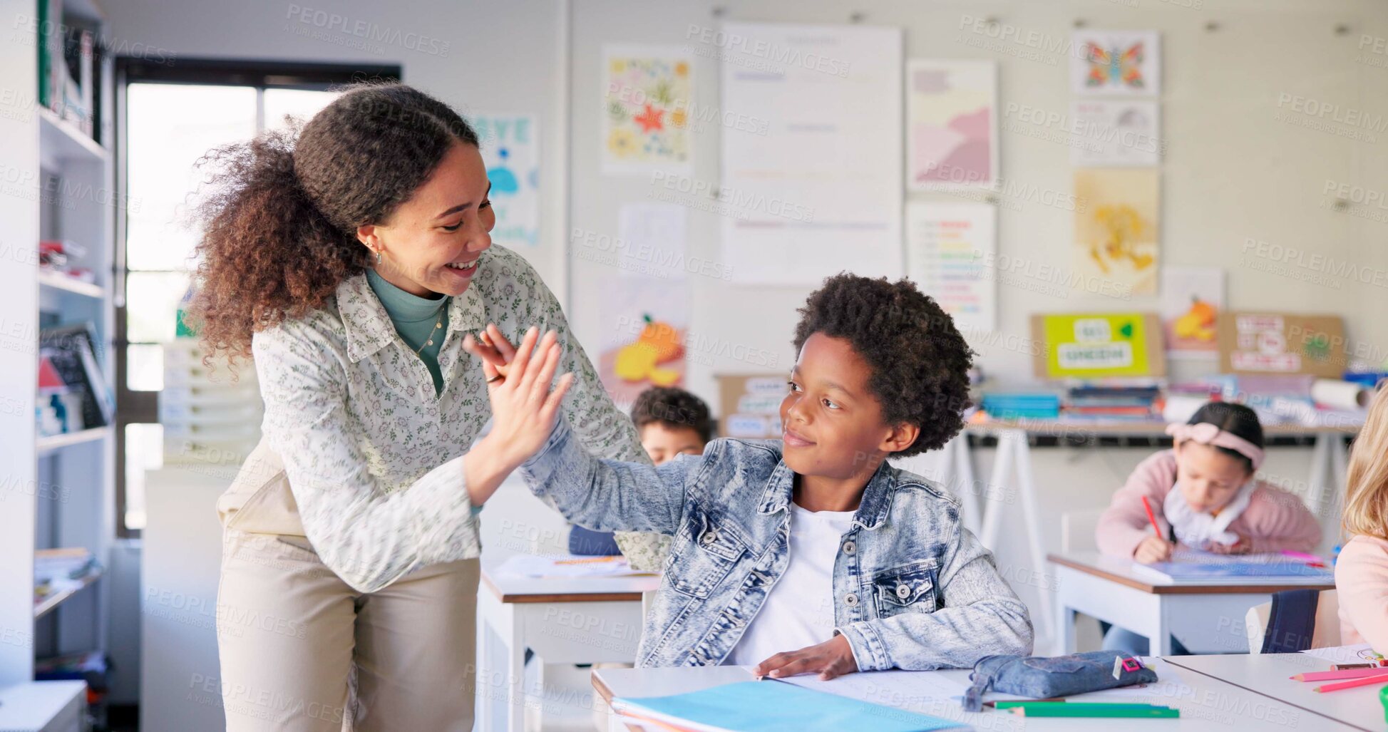 Buy stock photo Teacher woman, high five boy and classroom with achievement, success and mentorship for learning. Education, development and students with goals, knowledge and books with celebration, school and desk