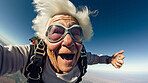 Selfie of a skydiving senior woman. Extreme sport fun retirement adventure