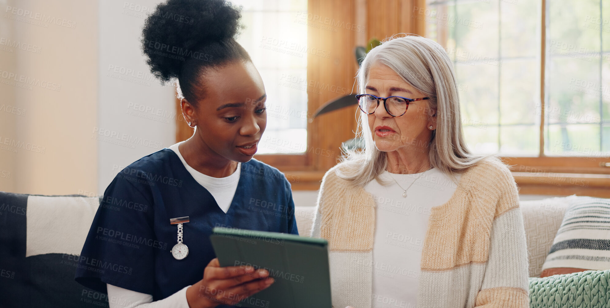 Buy stock photo Elderly, woman and nurse with tablet for consulting, medical information and communication with lens flare. Senior, professional or caregiver with touchscreen for online report, advisory and results