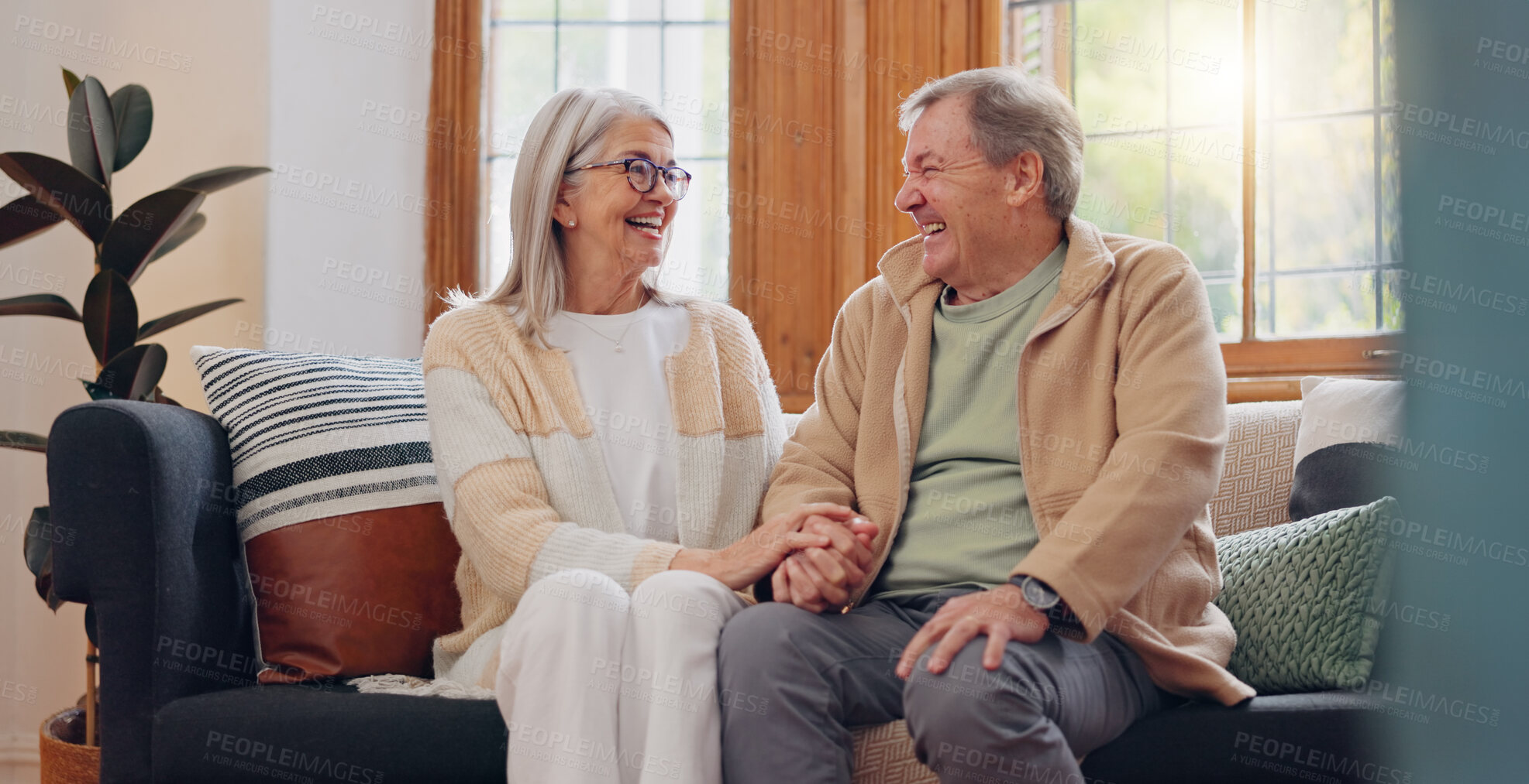 Buy stock photo Love, relax and senior couple laughing at funny joke, enjoy quality time together and bond on home living room sofa. Retirement, smile and elderly man, woman or people happy