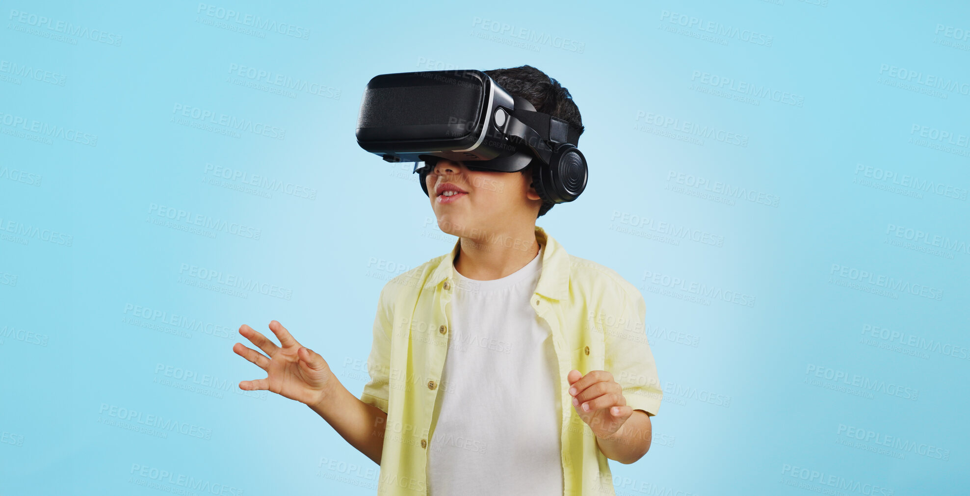 Buy stock photo Glasses, virtual reality and child in metaverse, 3d games or futuristic technology for school or futuristic e learning in studio. Kid with high tech, VR education and watch video on a blue background