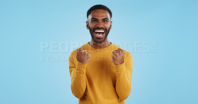 Buy stock photo Wow, news and happy man in studio with winner, fist or celebration, dance or victory on blue background. Surprise, success or portrait of guy winner with energetic reaction to prize, giveaway or deal