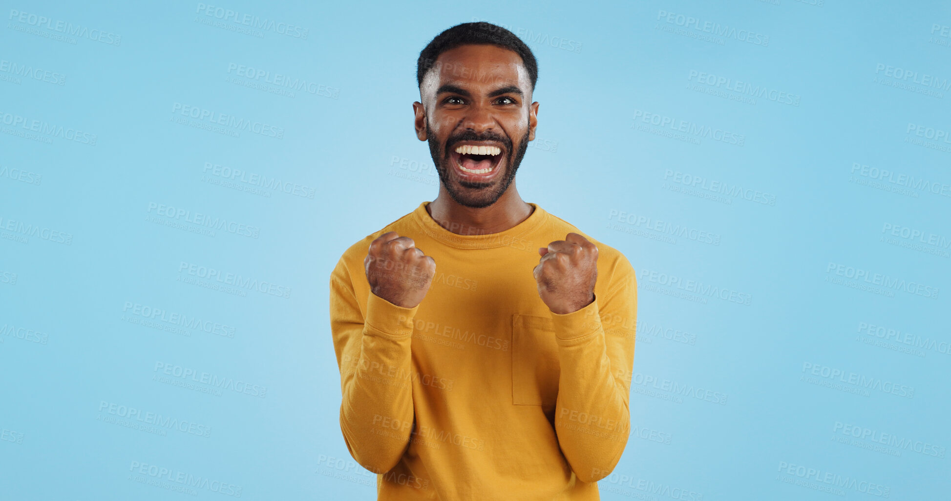 Buy stock photo Wow, news and happy man in studio with winner, fist or celebration, dance or victory on blue background. Surprise, success or portrait of guy winner with energetic reaction to prize, giveaway or deal