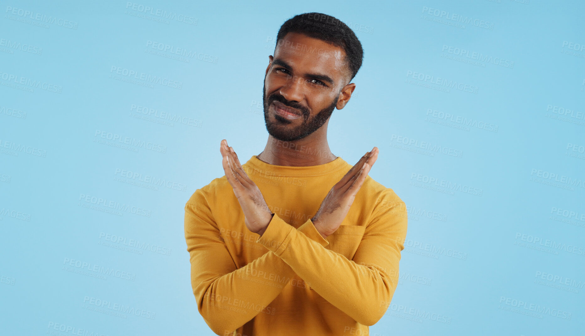 Buy stock photo Shaking head, no and face of a man with stop, rejection and disappointment on a studio background. Sad, angry and portrait of a person with a gesture for a protest, disapproval or refusal with mockup