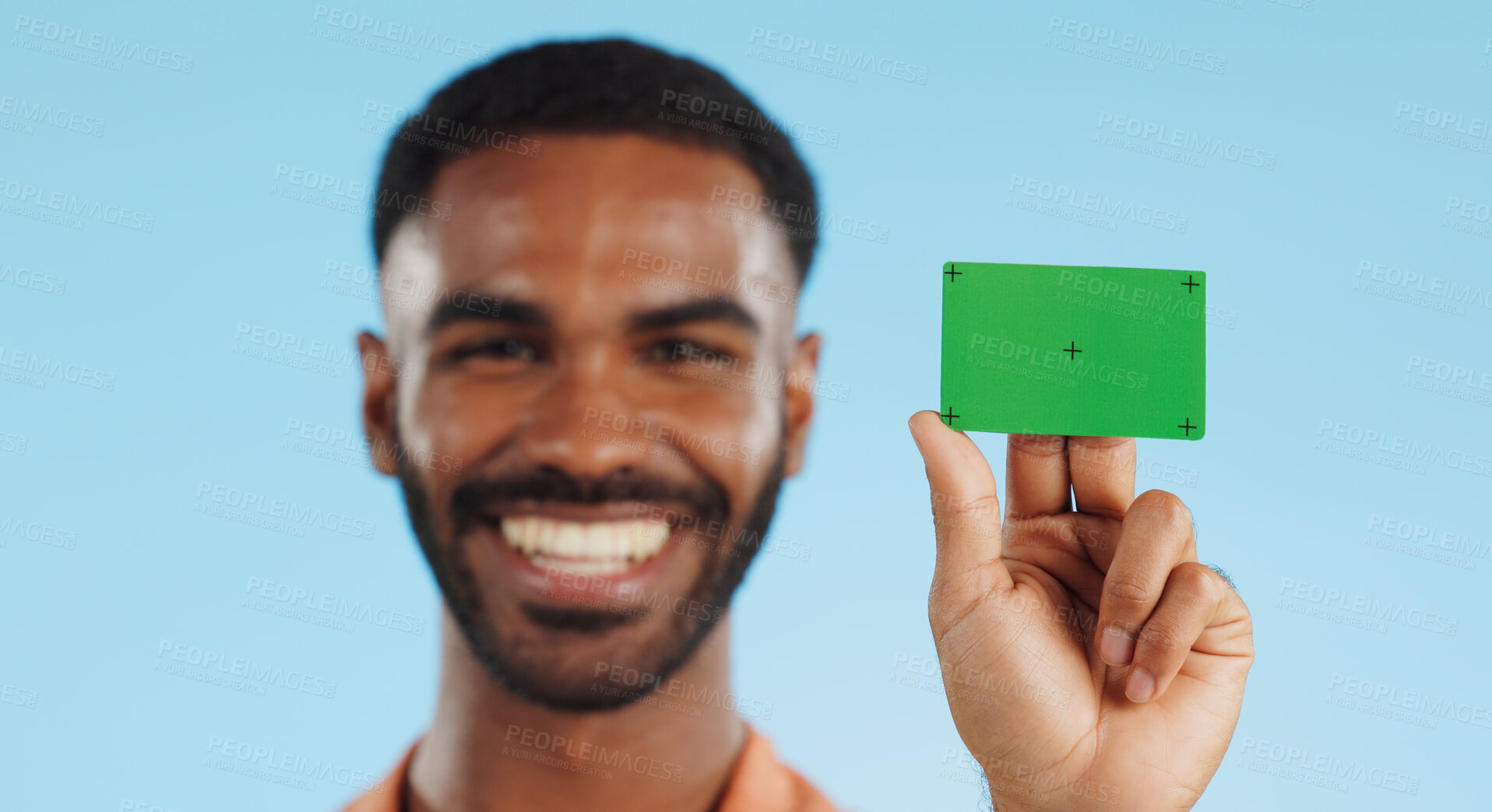 Buy stock photo Man, credit card and happy with green screen in studio for mockup, bank logo and face by blue background. Person, space and chromakey with tracking markers for fintech brand, review or promotion