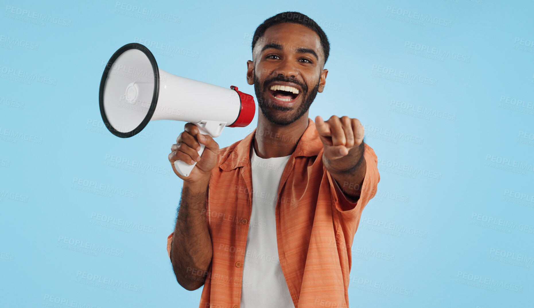 Buy stock photo Young man, megaphone and announcement, choice or broadcast for winner, join us or winning opportunity in studio. Face of african person with voice, pointing you and competition on a blue background