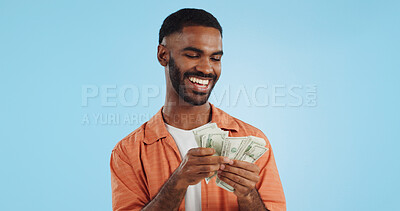 Buy stock photo Man, count money and happy in studio with success, bonus or dollar promotion with winning by blue background. Investor, trader or person with cash, salary or savings with smile for financial freedom goal