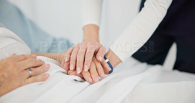 People, holding hands and care for life, support or trust in commitment, understanding or grief at hospital. Closeup of women touching in healthcare for loss, illness or virus on bed at the clinic