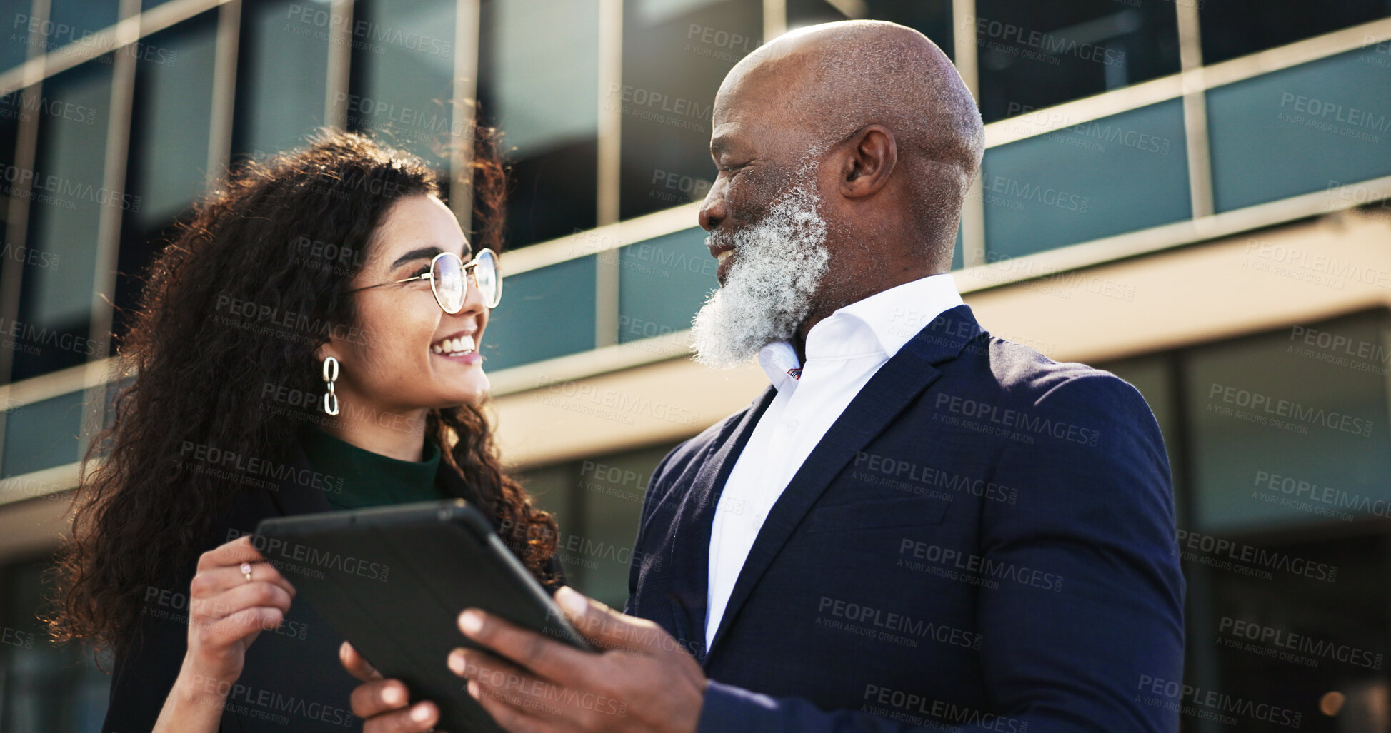 Buy stock photo Tablet, talking and businesswoman with manager in the city planning a legal strategy. Discussion, digital technology and team of professional lawyers working on case in collaboration in urban town.