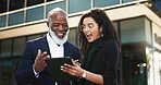 Tablet, talking and businesswoman with manager in the city planning a legal strategy. Discussion, digital technology and team of professional lawyers working on case in collaboration in urban town.