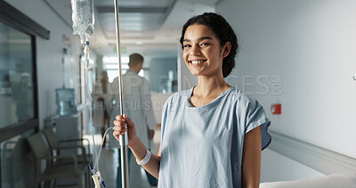 Iv drip, patient and portrait of happy woman in a hospital or clinic corridor with treatment for recovery from surgery. Intravenous, medicine and person with medical insurance for care and health