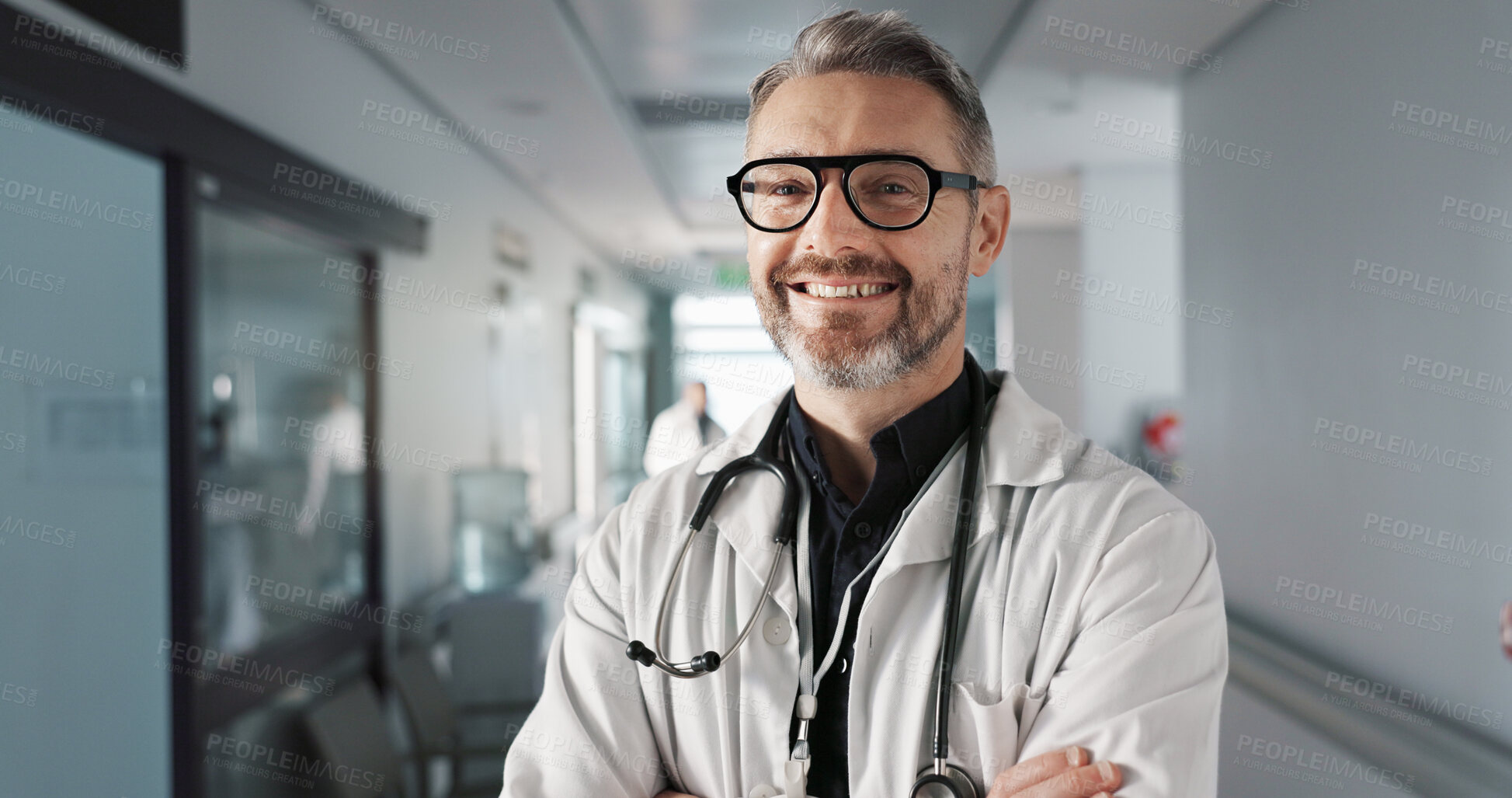 Buy stock photo Doctor in portrait, senior man with arms crossed and healthcare, smile with confidence at hospital with pride and help. Medical professional, trust and happy at clinic with expert and stethoscope