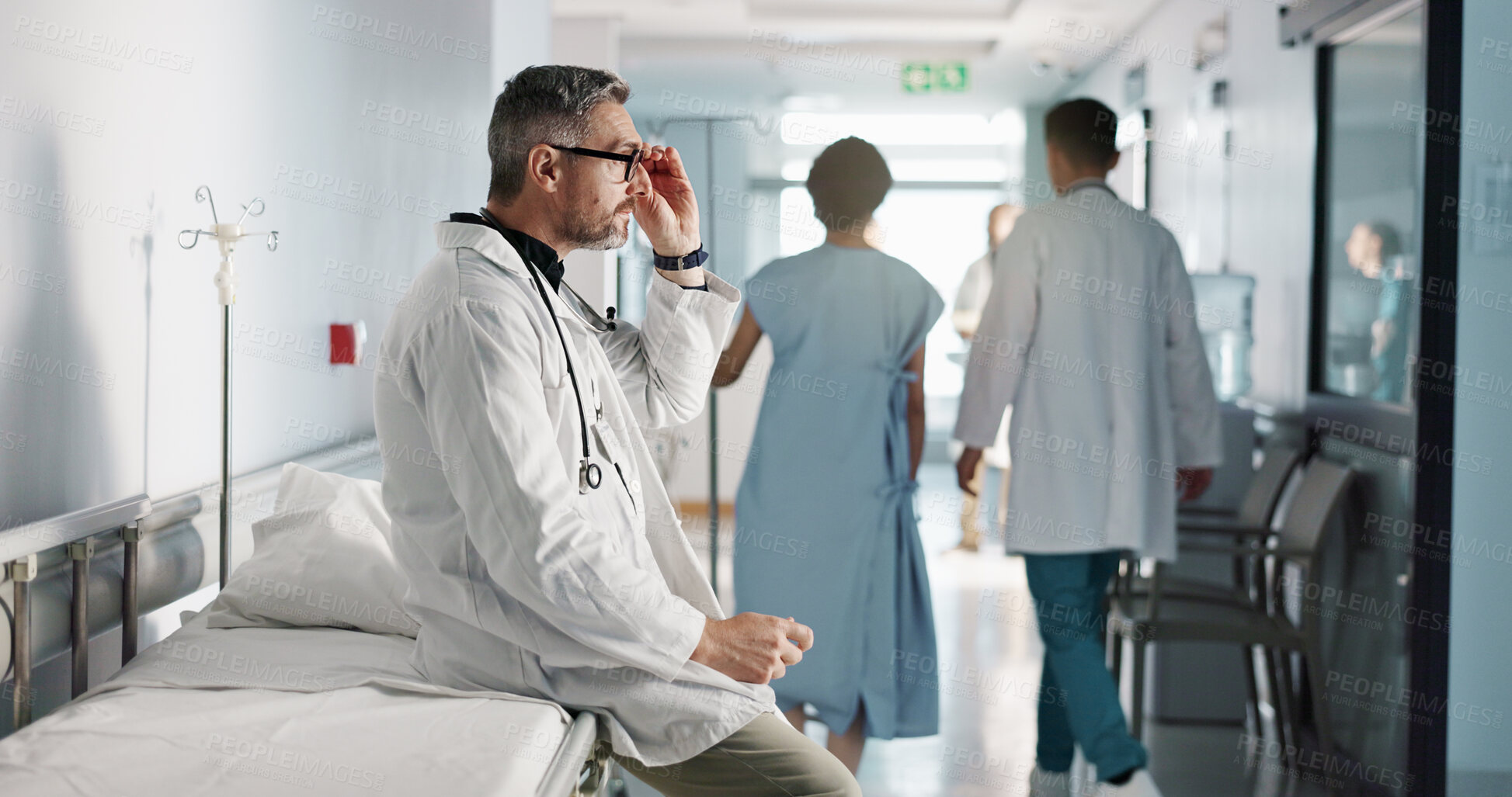 Buy stock photo Depression, grief or fail with a mature doctor in a hospital looking unhappy for healthcare or medical. Stress, mistake or loss with a sad man medicine professional in a professional medicare clinic