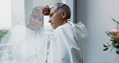 Sad, woman and thinking at window in hospital with stress, anxiety or fear of cancer, death or insurance. Senior, patient and depression in clinic with lady worried for future or mental health