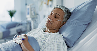 Sick, iv drip and senior woman in the hospital for consultation, surgery or treatment. Healthcare, recovery and elderly female patient resting in bed after operation or procedure in a medical clinic.