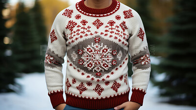Close-up of man wearing christmas sweater in snow. Christmas fashion.
