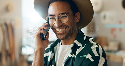Smile, talking and man on phone call in retail for networking, orders and planning stock. Happy, thinking and an Asian employee in fashion with conversation about a sale at a boutique or shop online