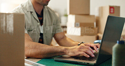 Man, laptop and hands typing in logistics, small business or supply chain for online order or delivery at office. Closeup of male person or employee working on computer and boxes for delivery at shop