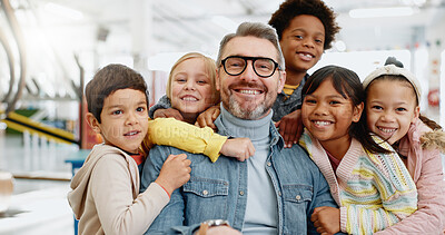 Buy stock photo Education, portrait and group of children with teacher at school with happiness for development. Man, kids or face with smile in classroom for knowledge, support and teaching with confidence and joy