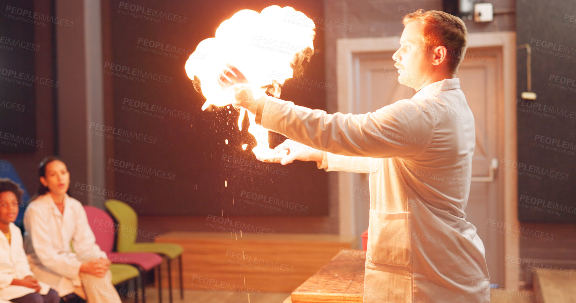 Buy stock photo Chemistry, students and fire experiment with teacher for development, innovation and knowledge in hall. Science, children or flame for chemical research, learning and teaching at school or exhibition