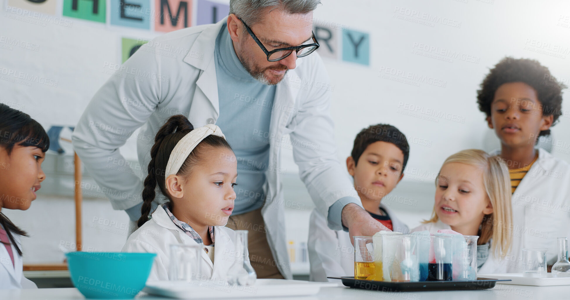 Buy stock photo Chemistry, teacher and students with education, classroom and science with research, conversation and experiment. School, man and children with educator, laboratory or kids with support and questions