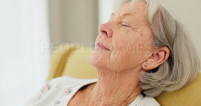 Senior woman, face and thinking on sofa at home to remember sad memory and relax in retirement. Serious elderly person or old lady at nursing facility with hope, negative emotion or Alzheimer disease