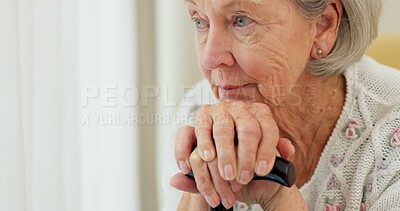 Senior woman, thinking and cane on home sofa to remember memory and relax in retirement. Serious or sad elderly person or old lady with a disability at nursing facility with Alzheimer and arthritis
