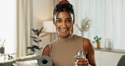 Buy stock photo Yoga, portrait or happy woman with a mat to start pilates for wellness or peace in home living room. Face, smile or healthy Indian person with a water bottle to begin holistic meditation for fitness