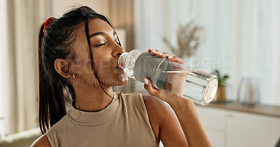 Buy stock photo Drinking water, yoga or Indian woman in home with health, fitness or wellness for natural hydration. Thirsty female person, tired or healthy girl with liquid bottle after pilates to detox or relax 