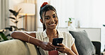 Woman, portrait and smile in home with cellphone, social media and update online subscription on sofa. Happy indian girl relax with smartphone app, download mobile games and chat to digital contact 