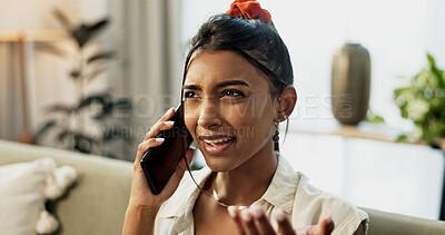 Phone call, argument and young woman on a sofa for relaxing in the living room of apartment. Fighting, annoyed and Indian female person on mobile conversation with cellphone in lounge of modern home.
