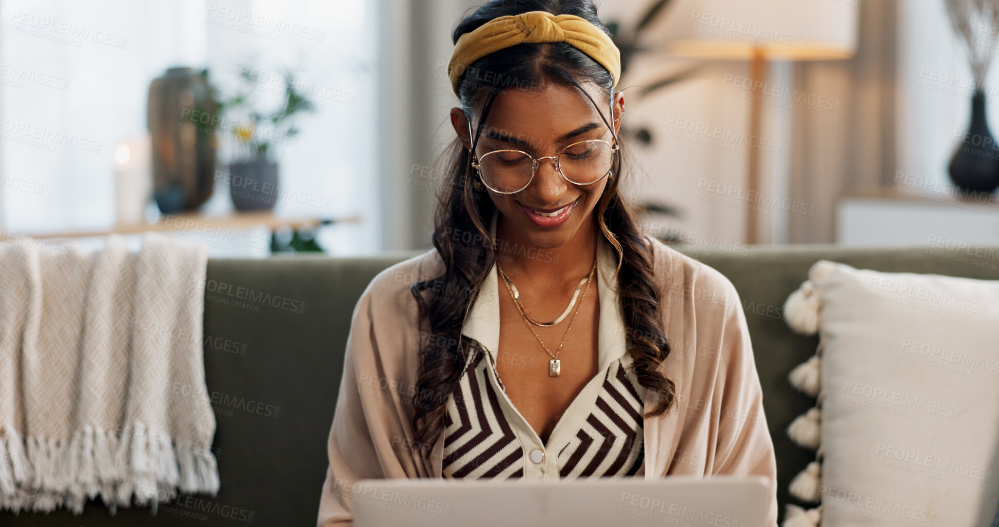 Buy stock photo Laptop, smile and a woman designer on a sofa in the living room of her home for remote work while planning. Computer, email and a happy young freelance employee working online for startup business