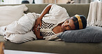 Stress, anxiety and woman with stomach pain on sofa for gas, constipation or pms crisis at home. Menstruation, tummy ache or lady person with gut health problem, virus or endometriosis in living room
