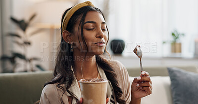 Woman, eating ice cream and living room on couch, thinking or idea for dessert, sweets or relax in home. Girl, gelato or frozen yogurt for snack, lounge sofa and house with memory, choice or decision