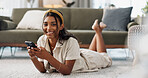 Woman, phone or portrait with lying on floor for communication, typing or social media scroll in living room of home. Indian, face or smartphone on ground for chat, texting or technology and internet