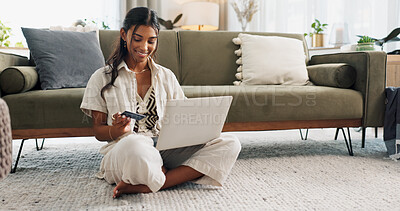 Woman, laptop and credit card for home online shopping, fintech payment and e commerce on living room floor. Young person typing on computer for internet banking, web subscription or loan on carpet