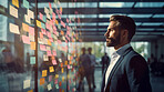 Business man looking and brainstorming with ideas on glass board and sticky note