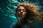 Model underwater wearing dress. Calm relaxation concept. Editorial concept.